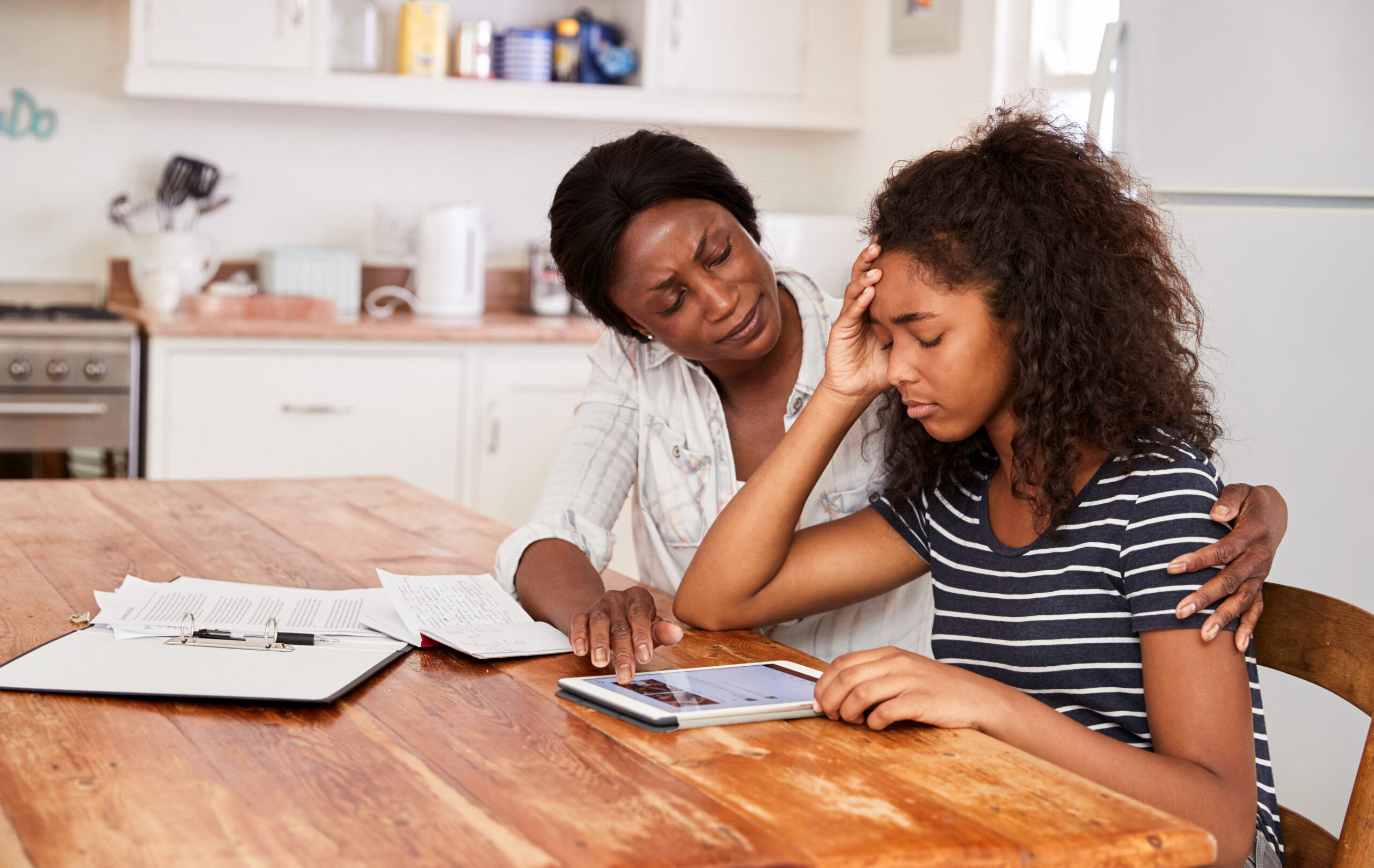 Mother,Helps,Stressed,Teenage,Daughter,With,Homework mother helps daughter