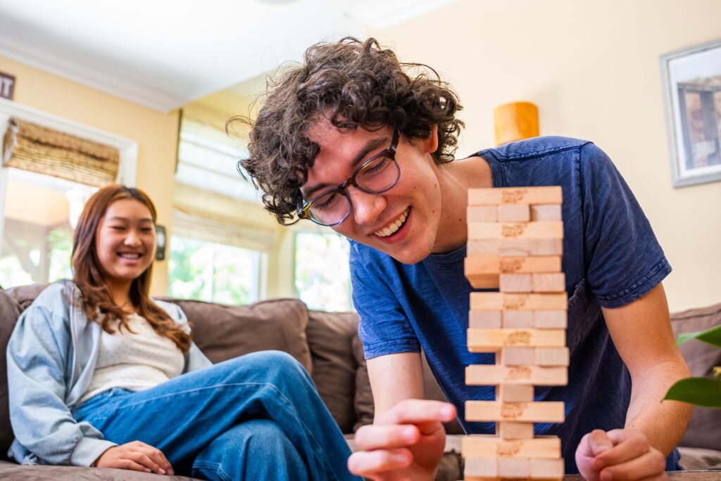 teens playing Jenga at adolescent program