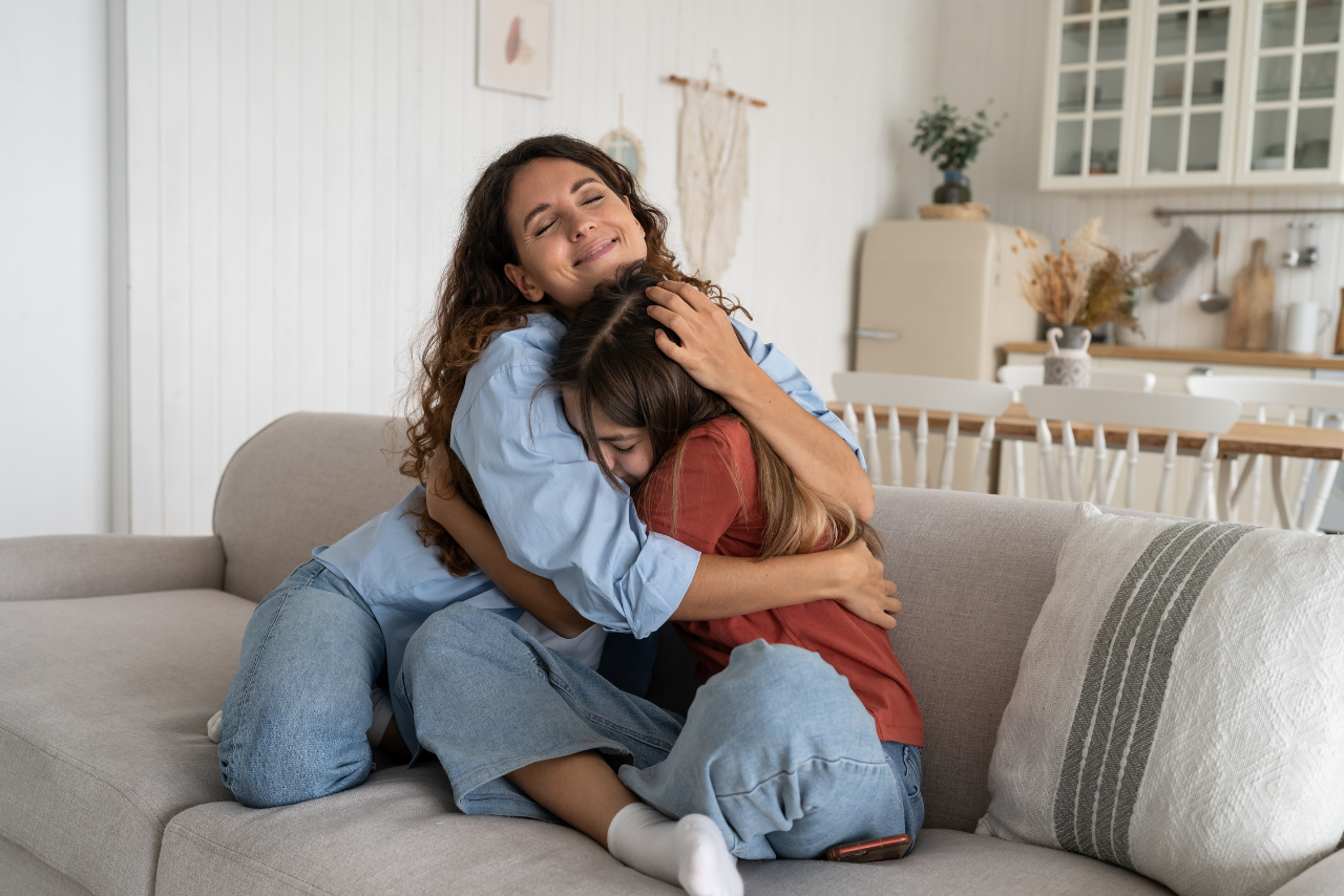 mother and daughter after going through therapy to find out father standing over his child showing what is a helicopter parent