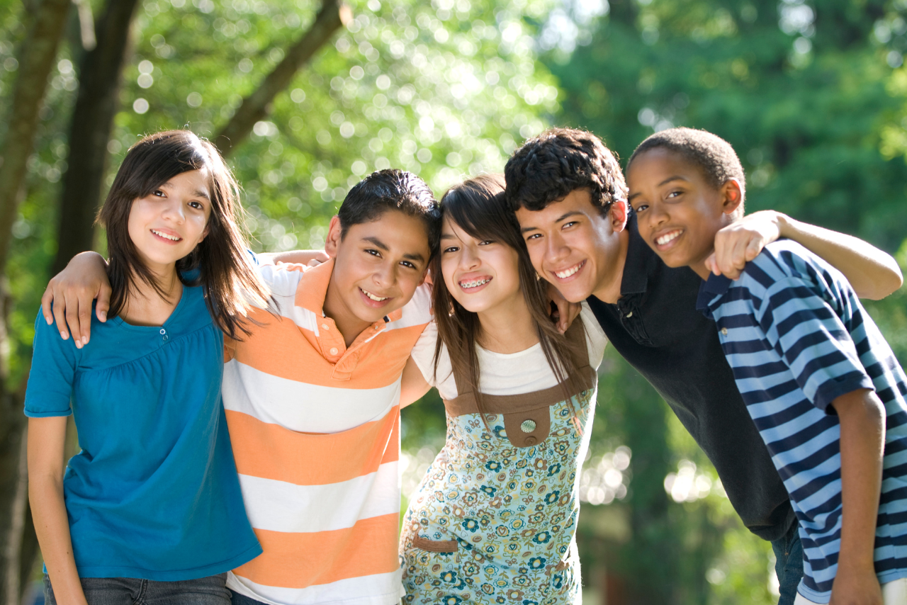 group of teens embracing after getting support therapy for teen brain development