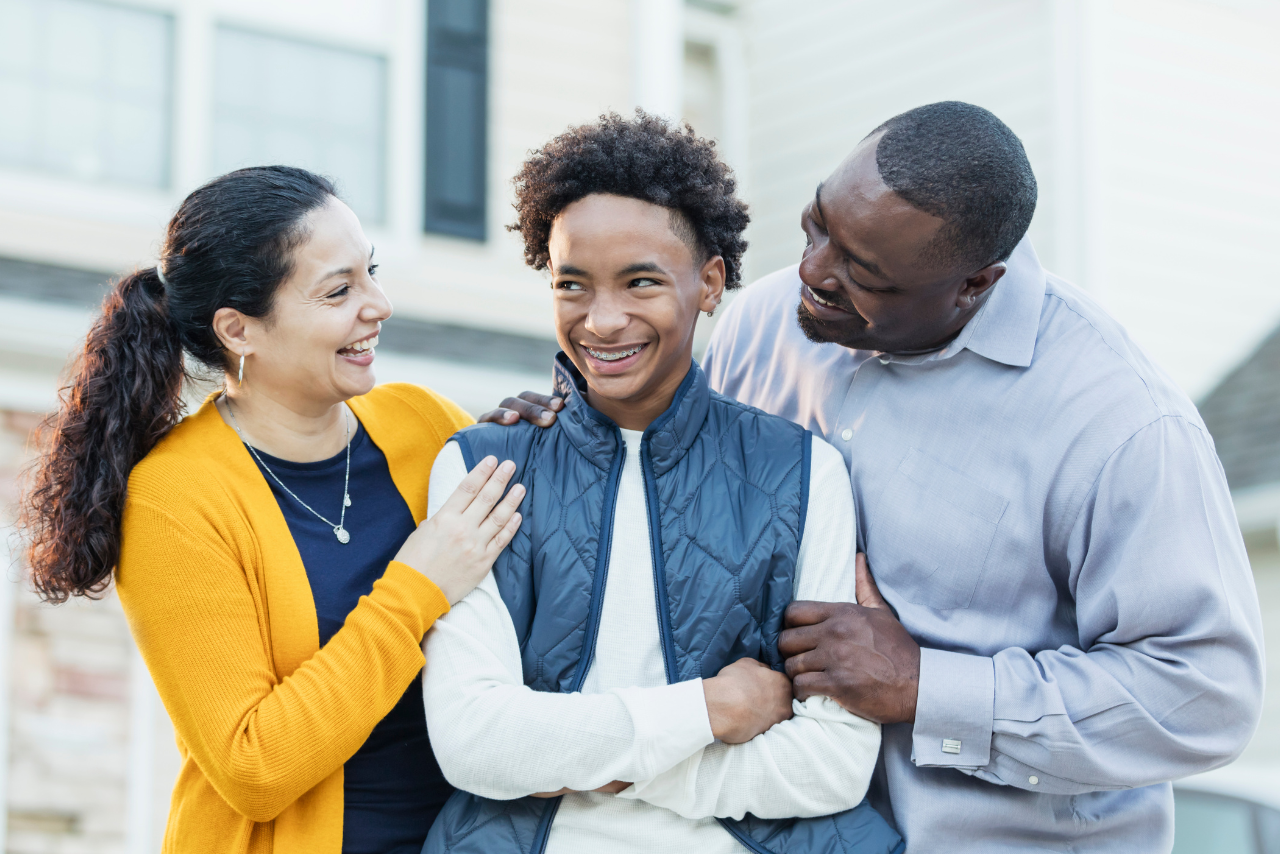 parents with their happy teenagers after receiving therapy for what is lighthouse parenting