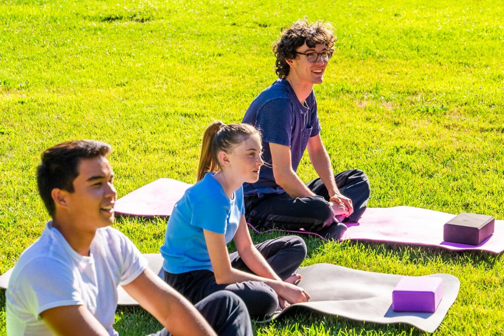 adolescents in outdoor yoga therapy