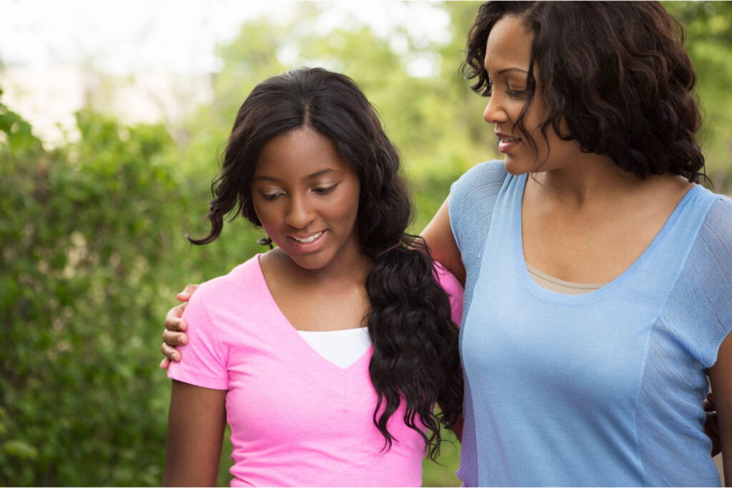 teen girl and parent work on rebuilding trust