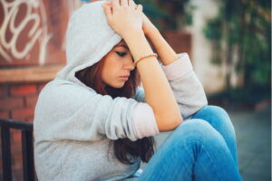 teen girl struggling with co-occurring mental health and substance use disorder
